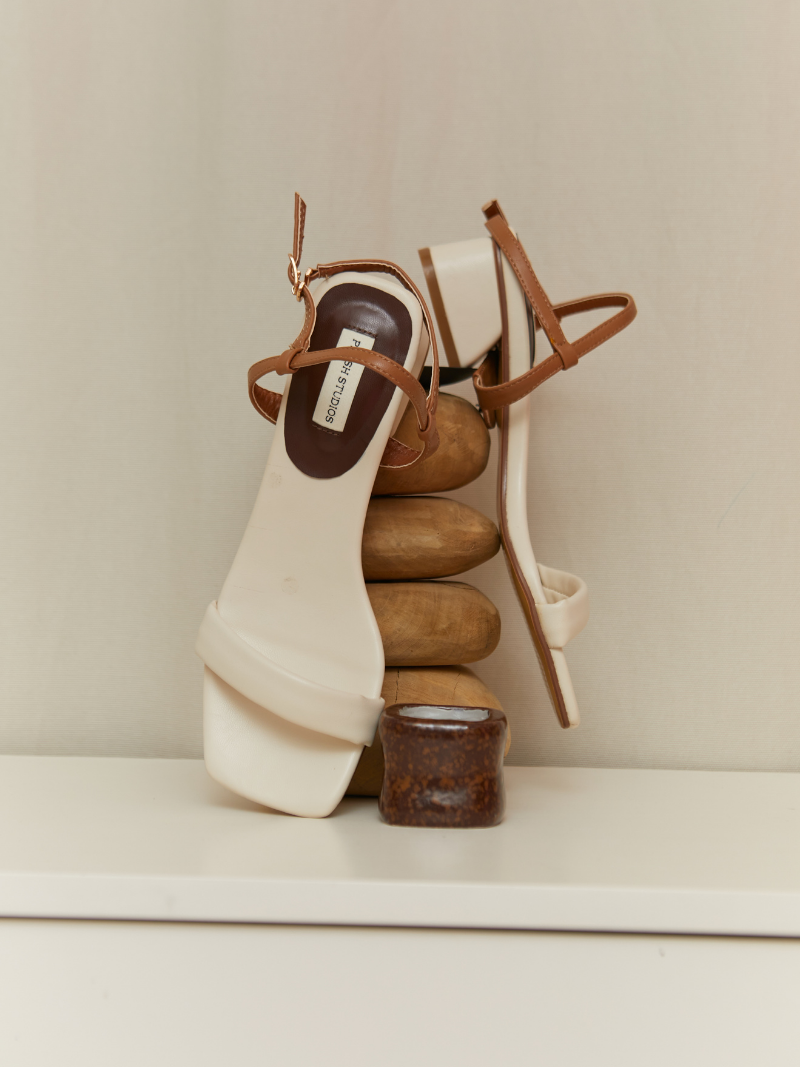 Cream coloured convertible ladies sandal with brown ankle strap top view