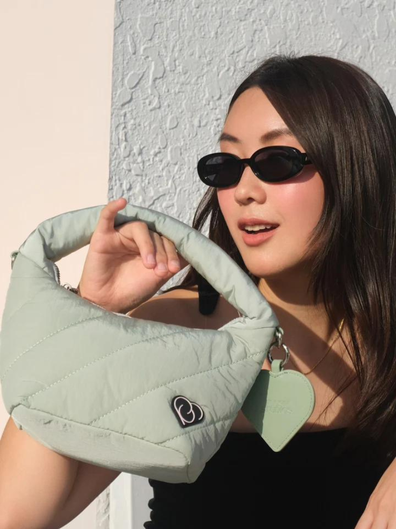 Sage coloured cushion bag with heart-shaped mirror