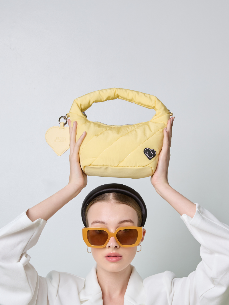Cushion Female Handbag in light yellow colour