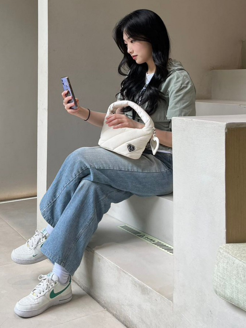 White colour cushion plush bag on model